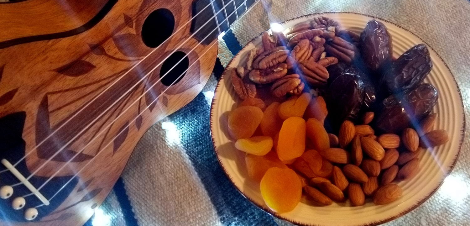 Ukulele with fruit and nuts