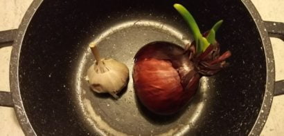 Onion and garlic in saucepan