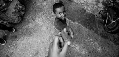People reaching for each other