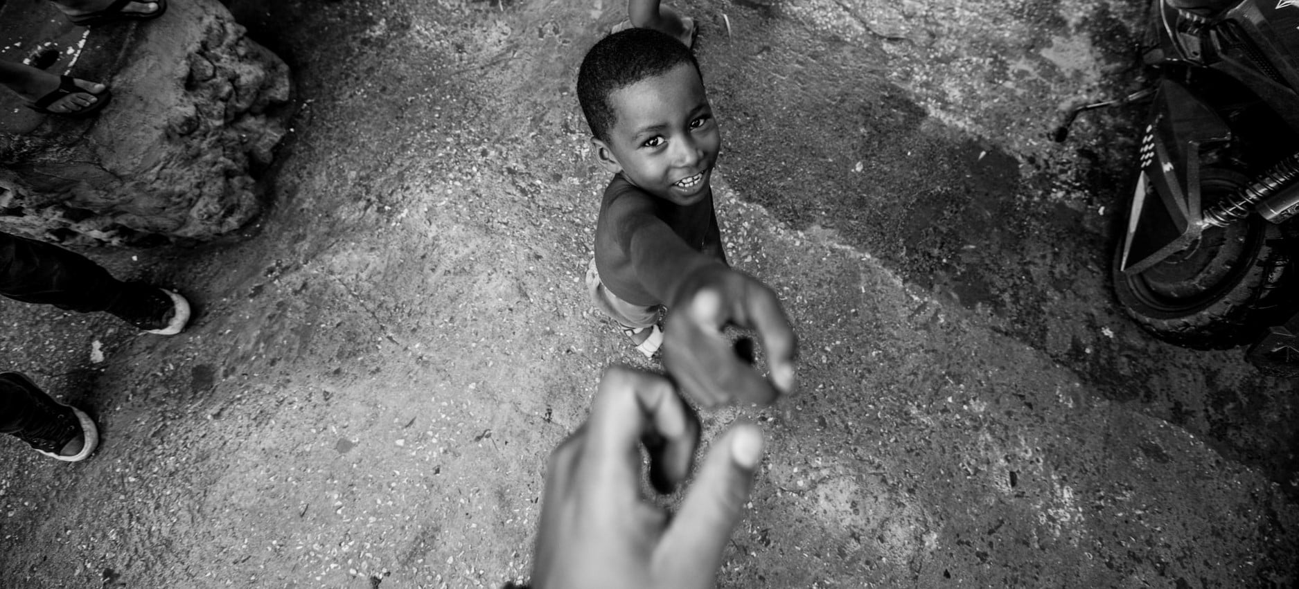 People reaching for each other