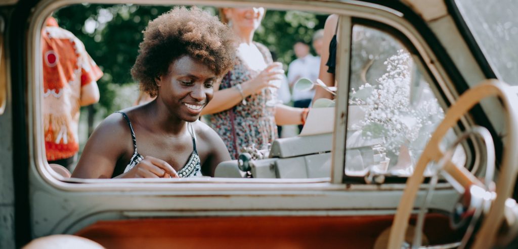 Happy guest with vintage car and typewriter