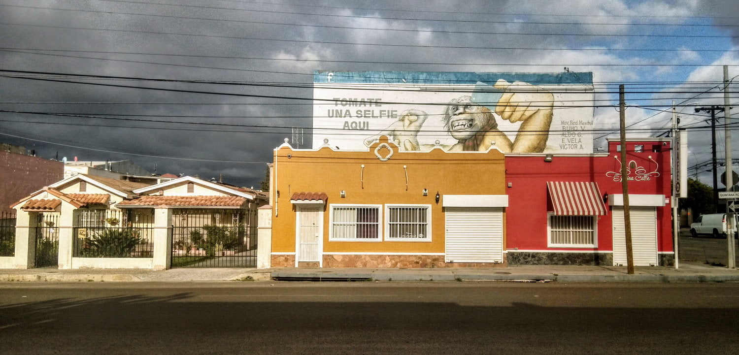 Empty Tijuana street with dramatic sky